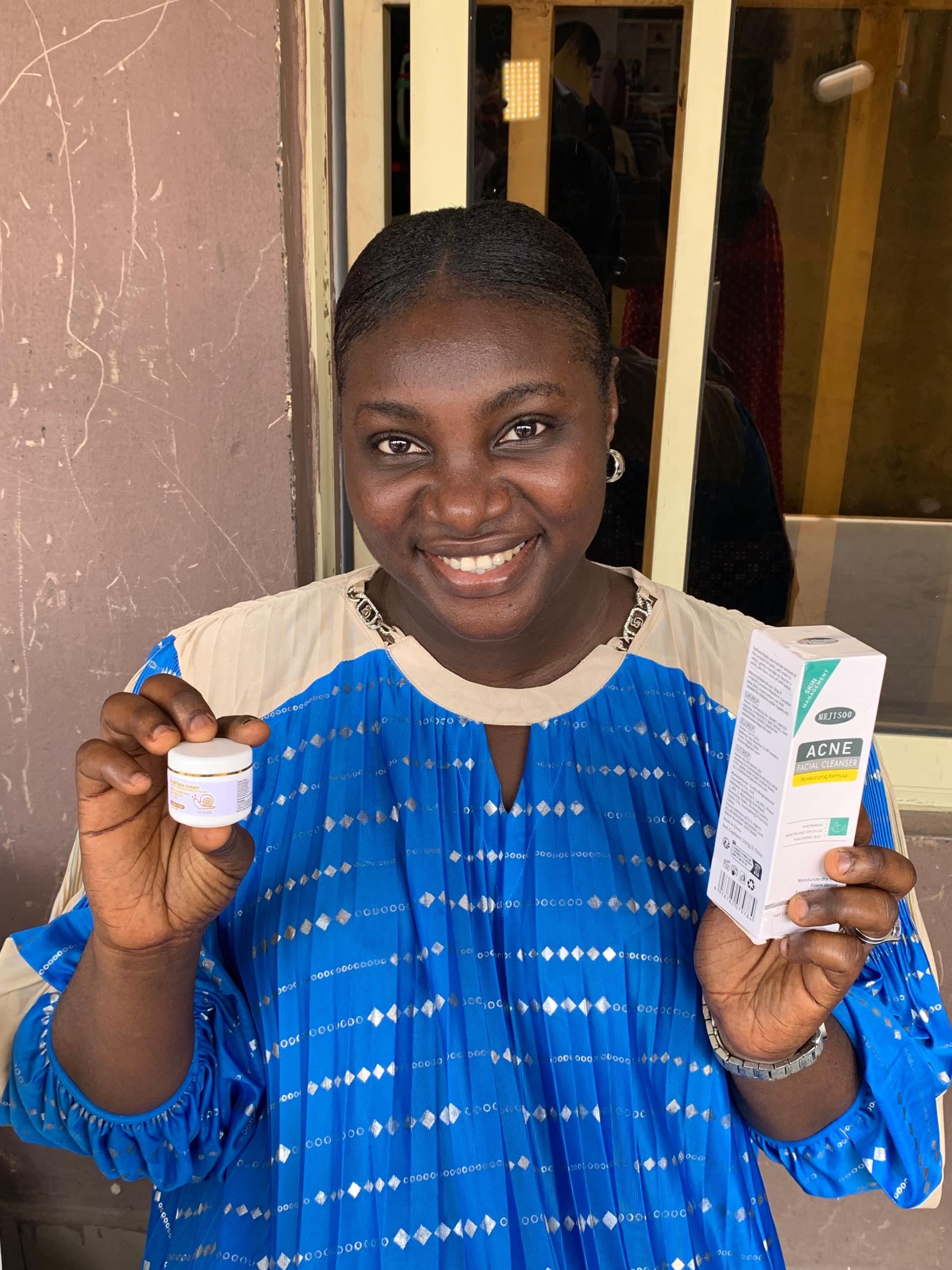 Customer holding Snail Face Cream and Face Wash